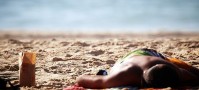 Backpacker passed out on the beach