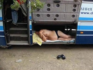 Drunk Backpacker Sleeping Inside the Bus Cargo