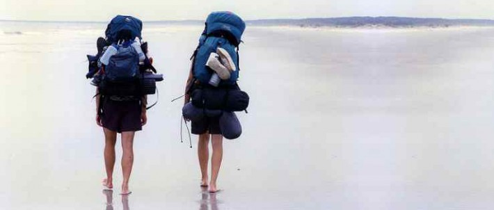 Backpackers backpacking on the beach
