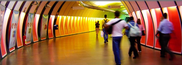 People in a colorful tunnel
