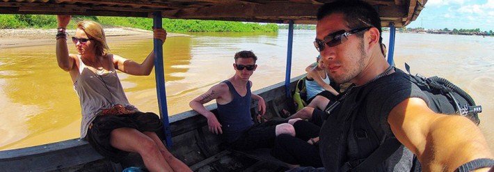 Backpackers in Laos Boat
